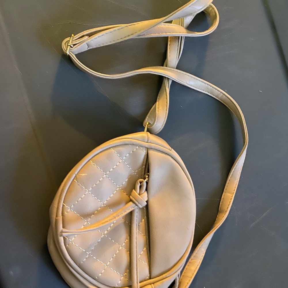 Tan small circular crossbody purse